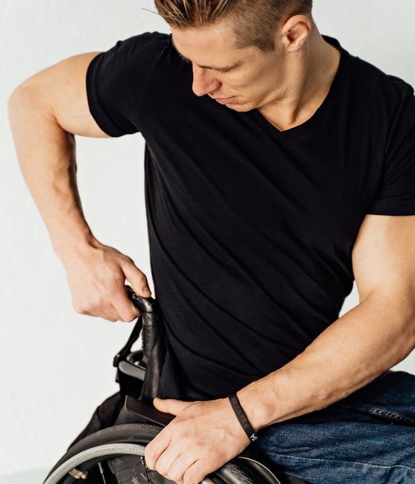 Man performing a functional strength exercise in a bright, modern studio.